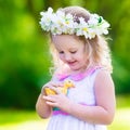 Little girl playing with a toy duck Royalty Free Stock Photo