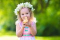 Little girl playing with a toy duck Royalty Free Stock Photo