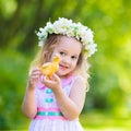 Little girl playing with a toy duck Royalty Free Stock Photo