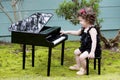 Little girl playing on toy piano Royalty Free Stock Photo