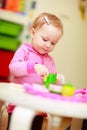 Little girl playing with toys