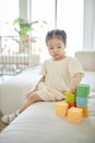 Little girl playing with toys at home Royalty Free Stock Photo