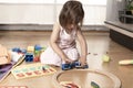 Little Girl Playing With Train Toys Royalty Free Stock Photo