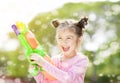 little girl playing water guns Royalty Free Stock Photo