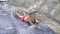 Little girl playing with water stream