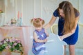 Little girl playing on wooden rocking horse Royalty Free Stock Photo