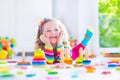 Little girl playing with wooden toys Royalty Free Stock Photo