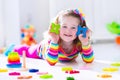 Little girl playing with wooden toys Royalty Free Stock Photo