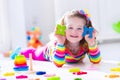 Little girl playing with wooden toys Royalty Free Stock Photo