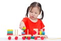 Little girl playing with wooden train toy Royalty Free Stock Photo