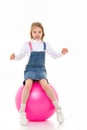 Little girl plays with a big ball for fitness Royalty Free Stock Photo