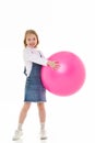 Little girl plays with a big ball for fitness Royalty Free Stock Photo