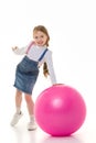 Little girl plays with a big ball for fitness Royalty Free Stock Photo