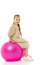 Little girl plays with a big ball for fitness Royalty Free Stock Photo