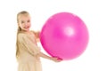 Little girl plays with a big ball for fitness Royalty Free Stock Photo