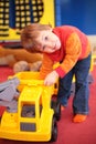 Little girl plays with car in kindergarten Royalty Free Stock Photo