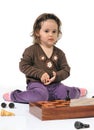 Little girl plays chess pieces Royalty Free Stock Photo