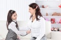 Little girl plays with her mother in the doctor Royalty Free Stock Photo