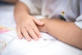 Little girl plays and learns to coloring Crayon on the paper in the ice-cream restaurant., Bangkok, Thailand