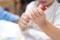 Little girl plays and learns to coloring Crayon on the paper in the ice-cream restaurant., Bangkok, Thailand