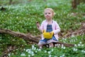 Little girl plays in spring forest at Easter Royalty Free Stock Photo