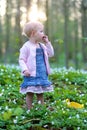 Little girl plays in spring forest at Easter Royalty Free Stock Photo