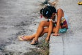 A little girl plays with a stone in Havana city, Cuba.