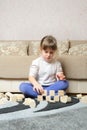 The little girl plays wooden toy cubes Royalty Free Stock Photo