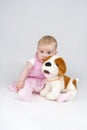 Little girl with plushy doggy. Royalty Free Stock Photo