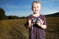 Little girl with pocket camera Royalty Free Stock Photo