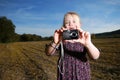 Little girl with pocket camera Royalty Free Stock Photo