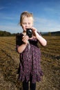 Little girl with pocket camera Royalty Free Stock Photo