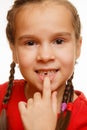 Little girl point by finger her first missing milk tooth, white background Royalty Free Stock Photo