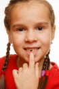 Little girl point by finger her first missing milk tooth, white background