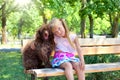 Little girl and poodle dog Royalty Free Stock Photo