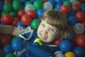 Little girl in the pool with balls Royalty Free Stock Photo