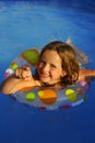 Little girl in pool pointing Royalty Free Stock Photo