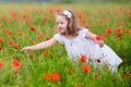 Little girl in poppy flower field Royalty Free Stock Photo