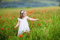 Little girl in poppy flower field Royalty Free Stock Photo