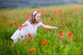 Little girl in poppy flower field Royalty Free Stock Photo