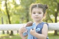 Little girl portrait holding a blue elephant doll in hands Royalty Free Stock Photo