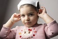 Little girl portrait with medical mask on her head