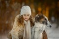 Little girl portrait with russian borzoi dog