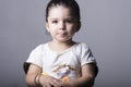 Little girl portrait seated on wooden chair