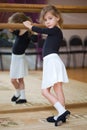 Little girl poses at ballet barre Royalty Free Stock Photo