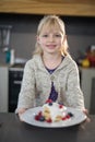 Little girl posing with a fruit pancake