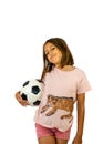 Little girl posing with a soccer ball Royalty Free Stock Photo