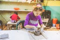 Little Girl At Pottery Workshop Working With Clay