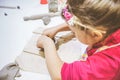 Little Girl At Pottery Workshop Working With Clay