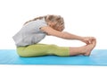 Little girl practicing yoga on white background